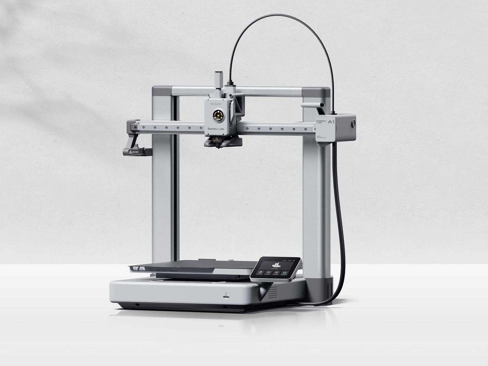 Bambu Lab A1 printer with its nozzle above the build plate
